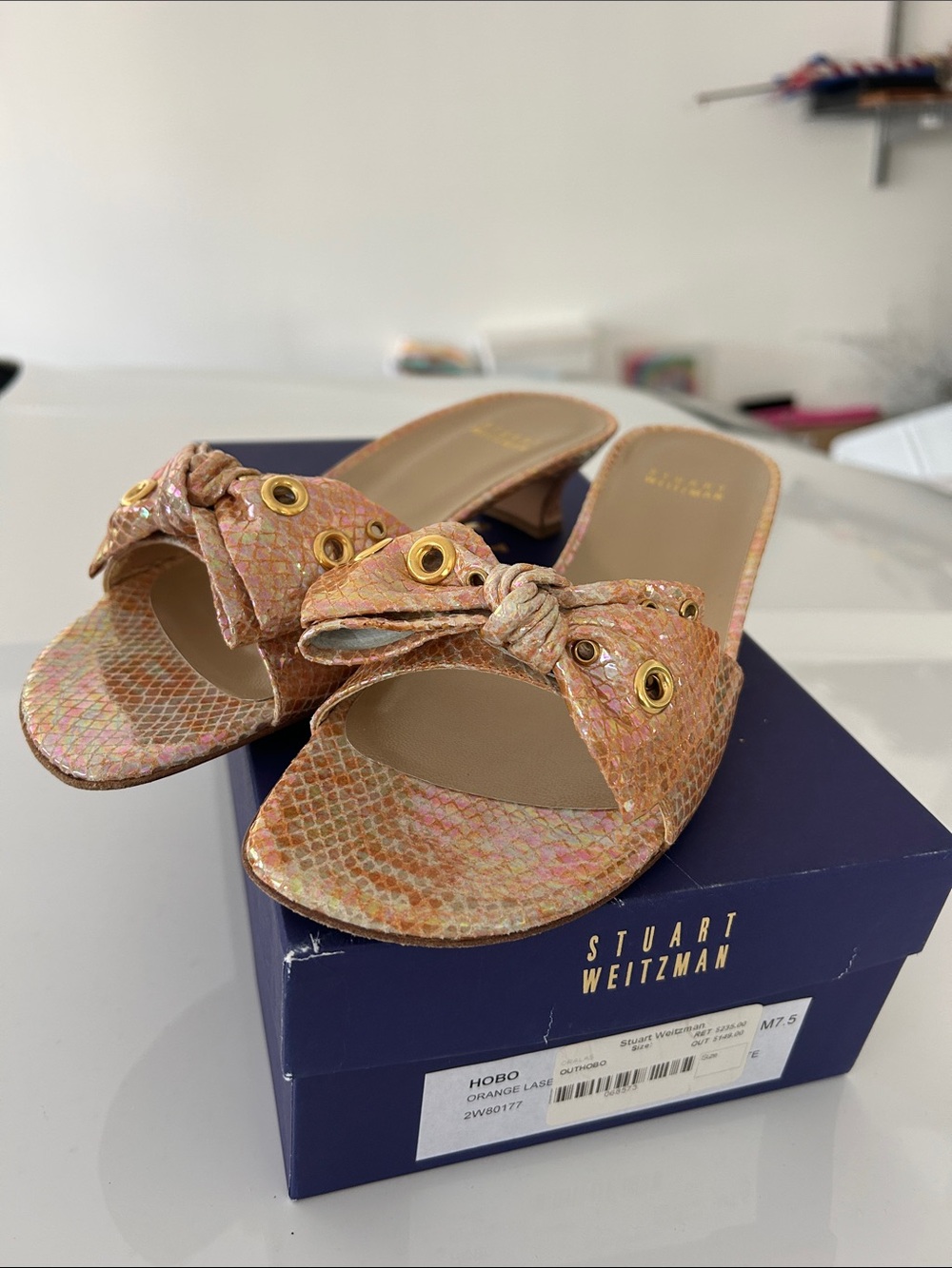 Stuart Weitzman Peach-Pink Knotted Slide Mules with Gold Eyelets
